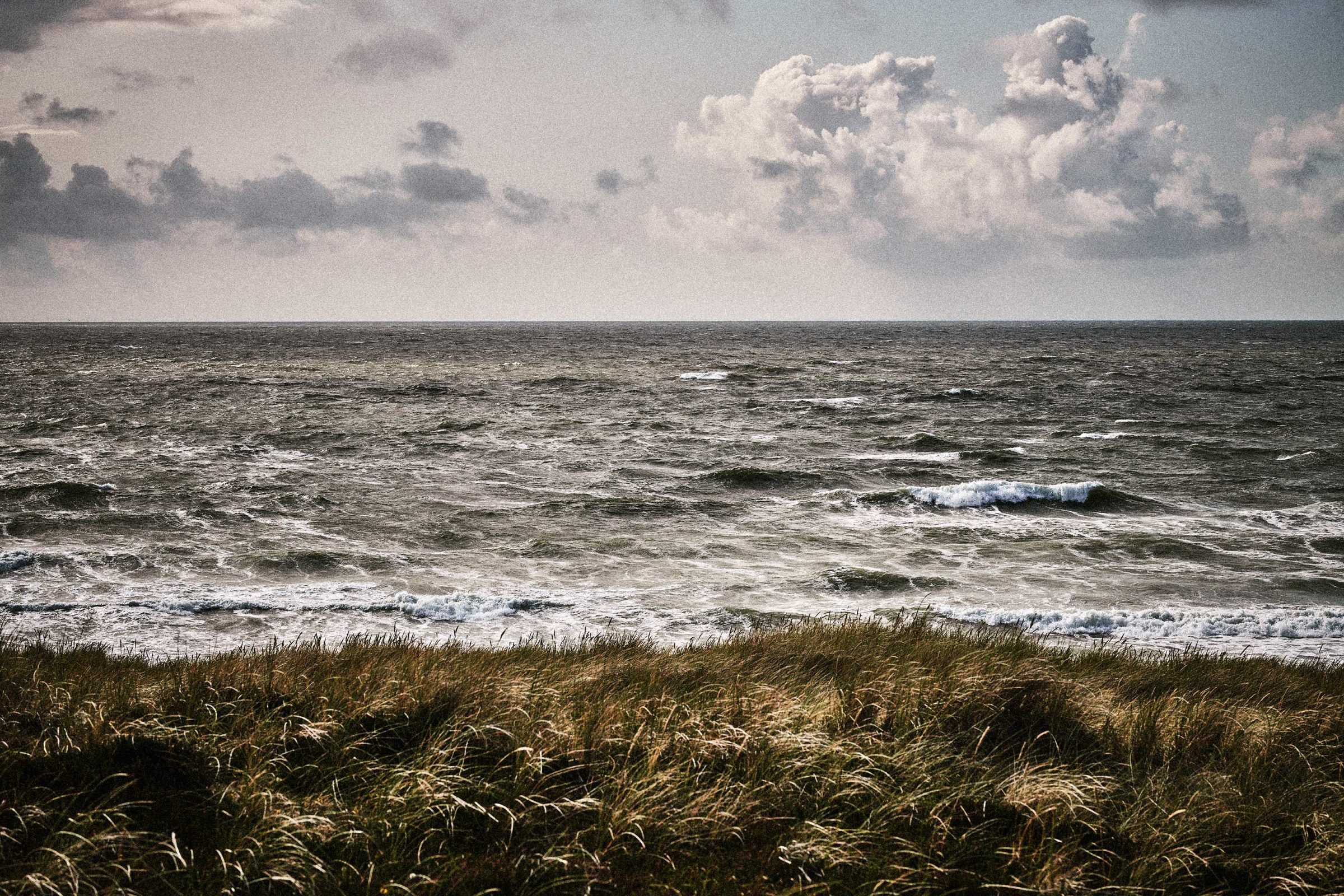 Rough North Sea seen over dune grass on Sylt